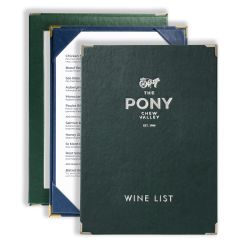 Kensington leather tariff boards in green, navy and gold corner finishes, shown holding a printed price list insert